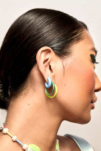 Model wears Bianca Mavrick Colour Enamel Hoop Earrings