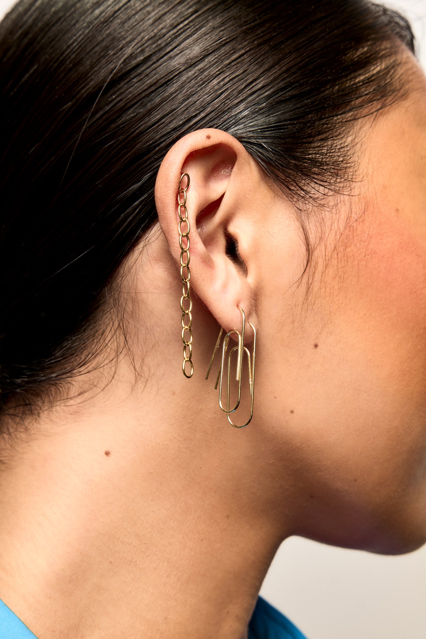 Model Earlobe Closeup wearing Bianca Mavrick Paperclip and Fine Chain Earrings