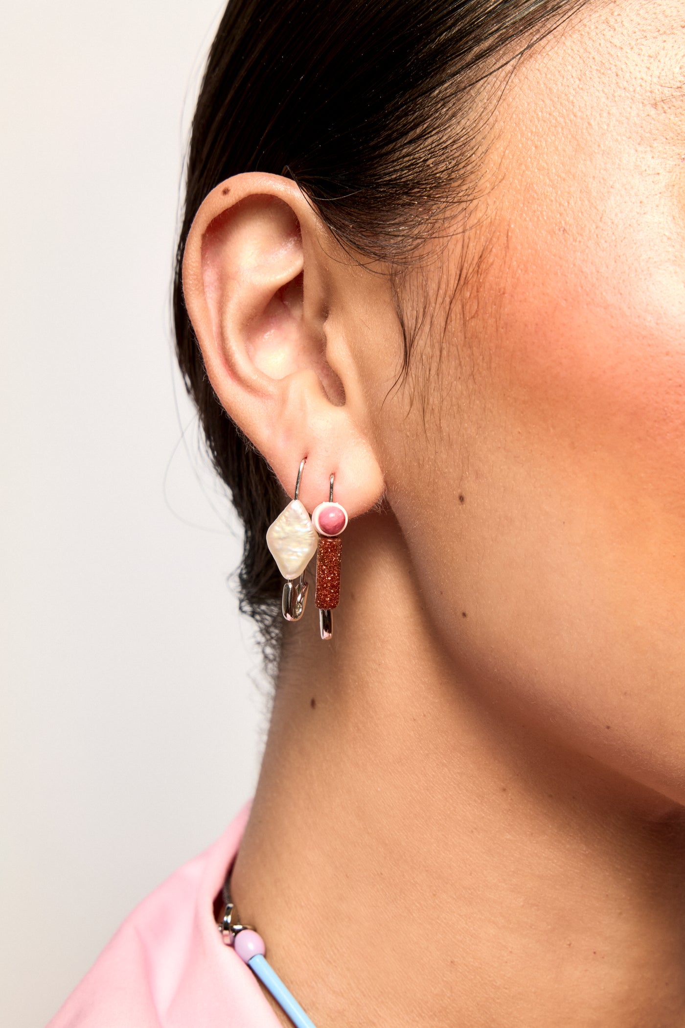 Model wearing Bianca Mavrick Safety Pin Earring Pink Rhodochrosite