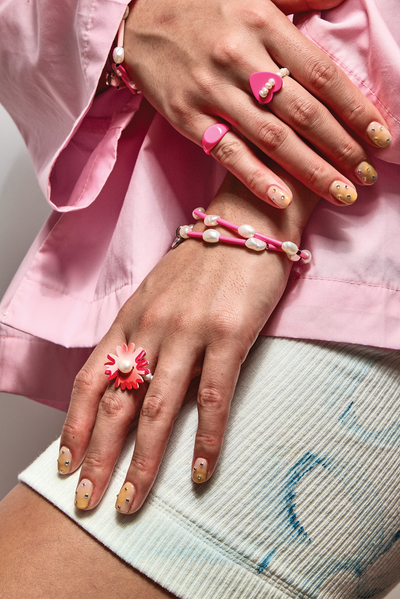 Model wearing Bianca Mavrick Jewellery Stretch Pearl Bracelet Neon Pink