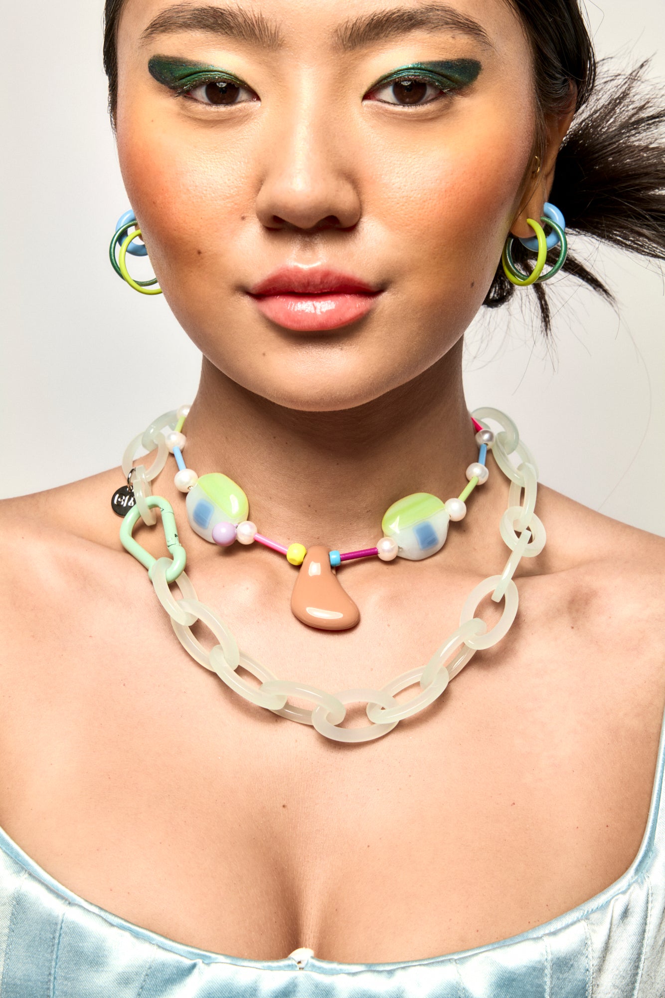 Bianca Mavrick x Lawn Bowls Collaboration Model Wearing Face Necklace