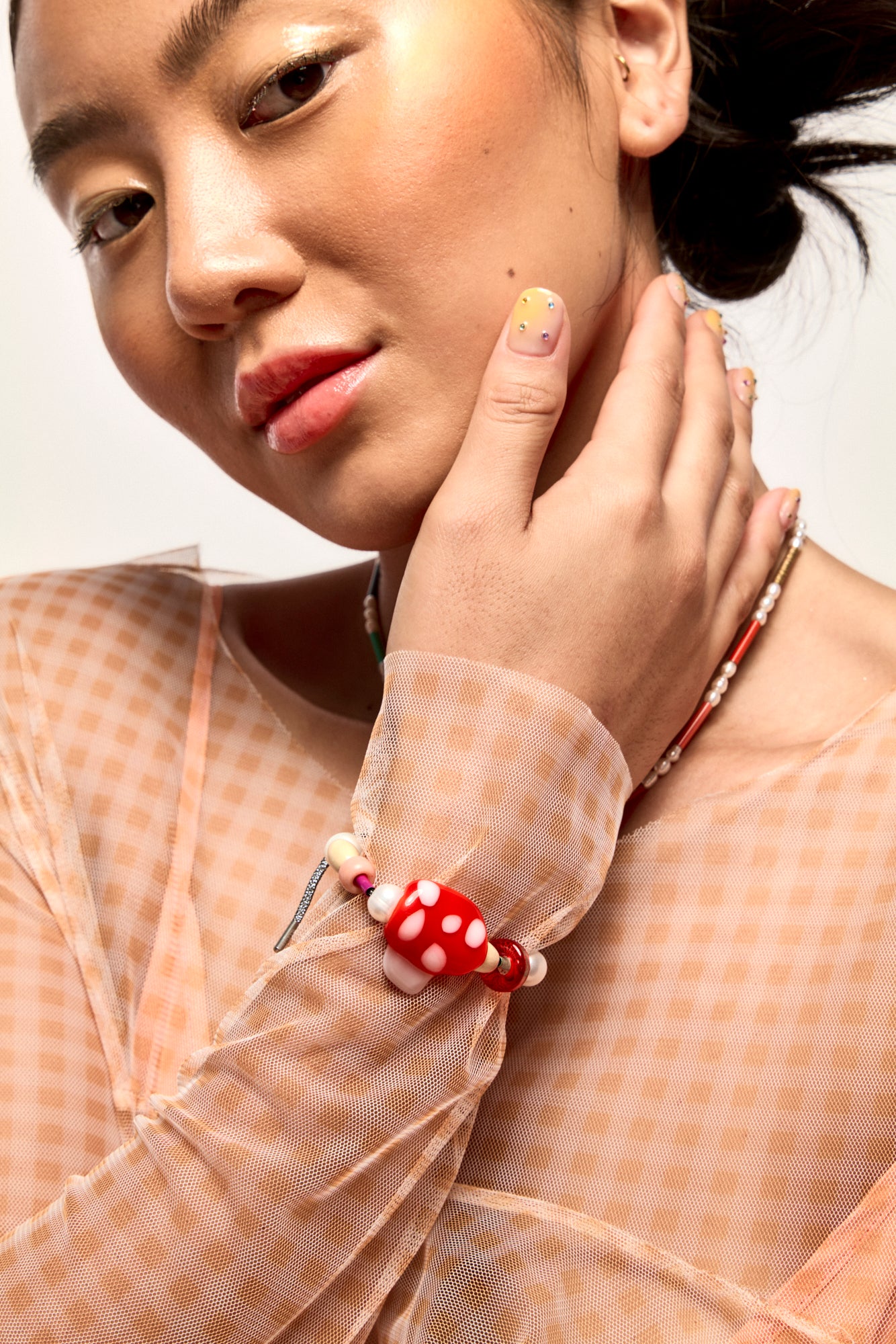 Model wearing Bianca Mavrick x Lawn Bowls Collaboration Mushroom Bracelet On Wrist Glass Jewellery