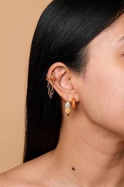 ear stack with fine chain earring, enamel hoop, and safety pin earring 